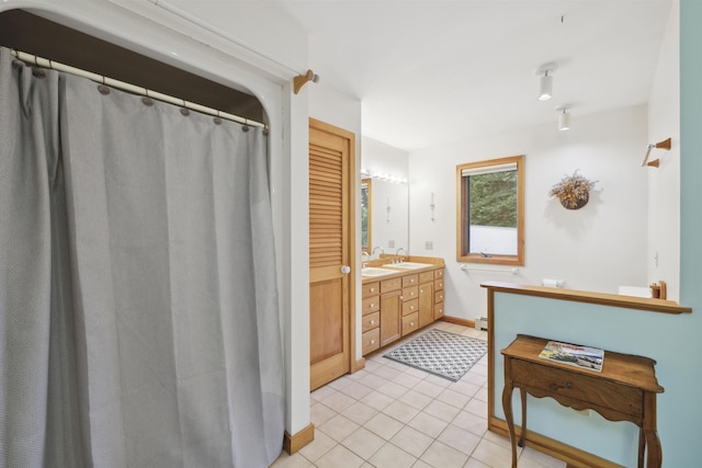 263 Old Post Rd, Newbury, NH 03255 - full bathroom featuring tile patterned flooring, double vanity, a baseboard heating unit, and baseboards