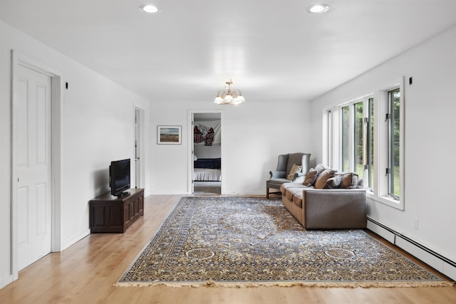 263 Old Post Rd, Newbury, NH 03255 - living area with a baseboard heating unit, a chandelier, light wood finished floors, recessed lighting, and baseboards