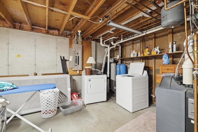 263 Old Post Rd, Newbury, NH 03255 - unfinished below grade area featuring electric panel, washing machine and clothes dryer, a heating unit, and a water pressure tank