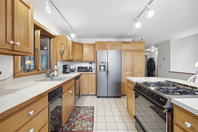 263 Old Post Rd, Newbury, NH 03255 - kitchen featuring stainless steel fridge, black range with gas cooktop, rail lighting, a sink, and light countertops