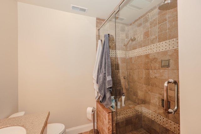 65 Victoria St Unit 8, Manchester, NH 03104 - bathroom with toilet, vanity, a shower stall, and baseboards