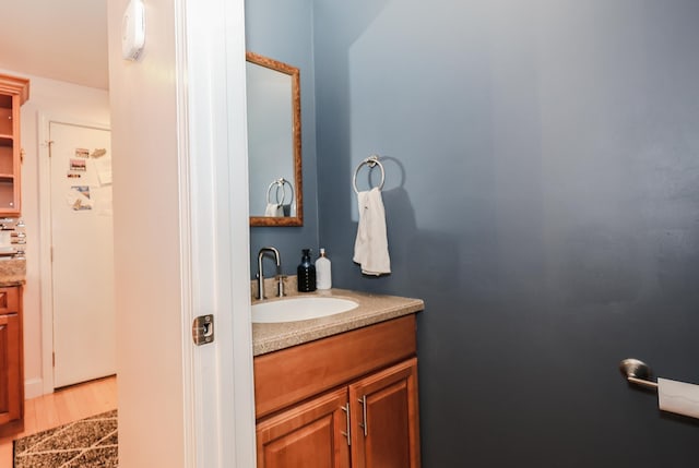 65 Victoria St Unit 8, Manchester, NH 03104 - bathroom featuring vanity and wood finished floors