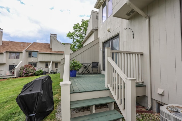 65 Victoria St Unit 8, Manchester, NH 03104 - wooden deck with central AC, a yard, and a grill