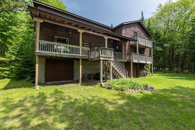 16 Mckinnon Rd, Washington, NH 03280 - back of property with a deck, a yard, and stairs