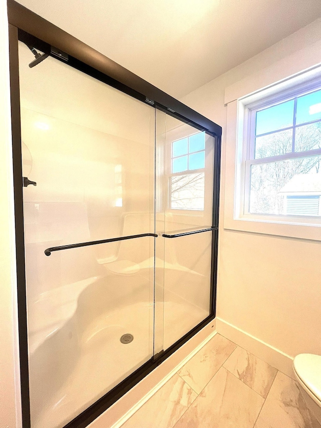 3 Crocket St, Rochester, NH 03867 - full bathroom with a shower stall, marble finish floors, plenty of natural light, and toilet