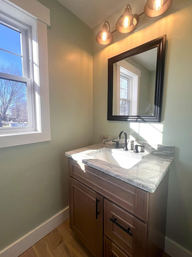 3 Crocket St, Rochester, NH 03867 - bathroom with healthy amount of natural light, vanity, and baseboards