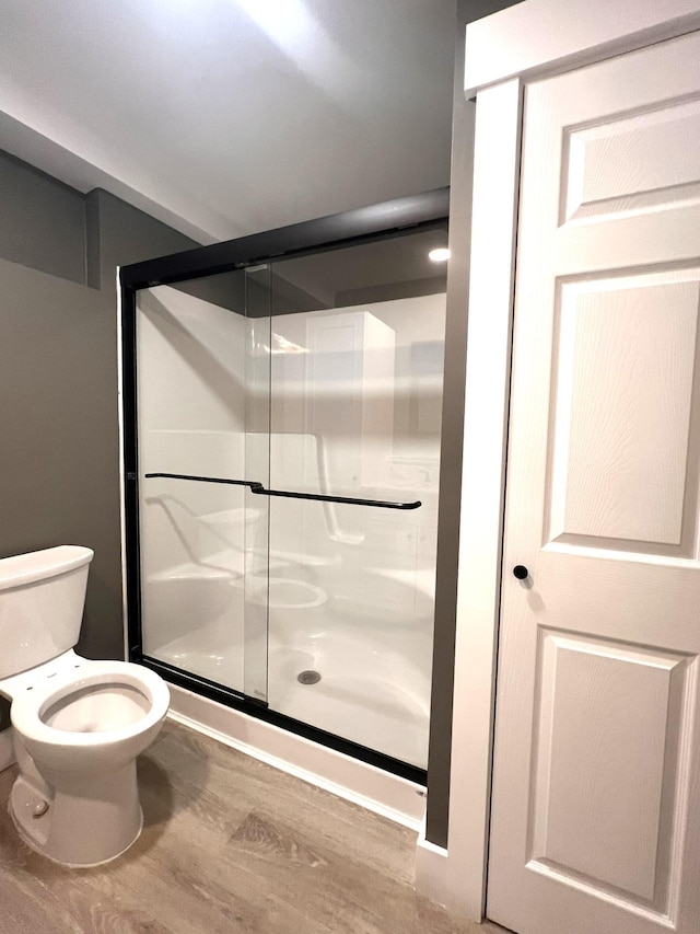 3 Crocket St, Rochester, NH 03867 - full bath featuring toilet, a stall shower, and wood finished floors