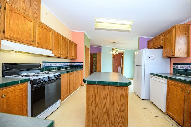 19/22 River St, Seabrook, NH 03874 - kitchen featuring gas range oven, dishwasher, under cabinet range hood, ornamental molding, and a center island
