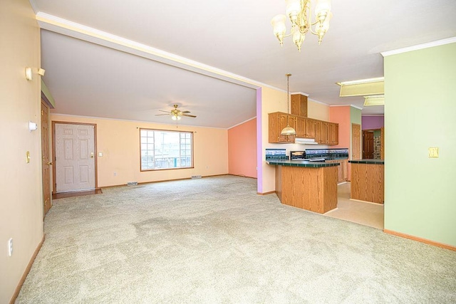 19/22 River St, Seabrook, NH 03874 - kitchen with brown cabinets, baseboards, light carpet, crown molding, and stove