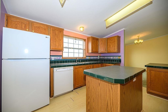 19/22 River St, Seabrook, NH 03874 - kitchen with white appliances, a sink, a center island, brown cabinetry, and a chandelier