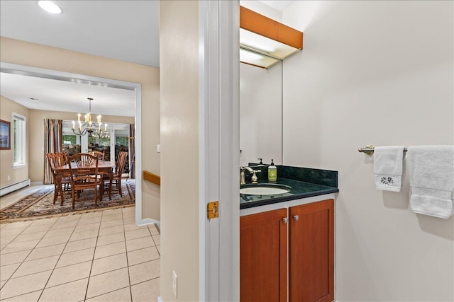 188 Foster Farm Rd, Stowe, VT 05672 - bathroom with vanity, a chandelier, tile patterned floors, and baseboards