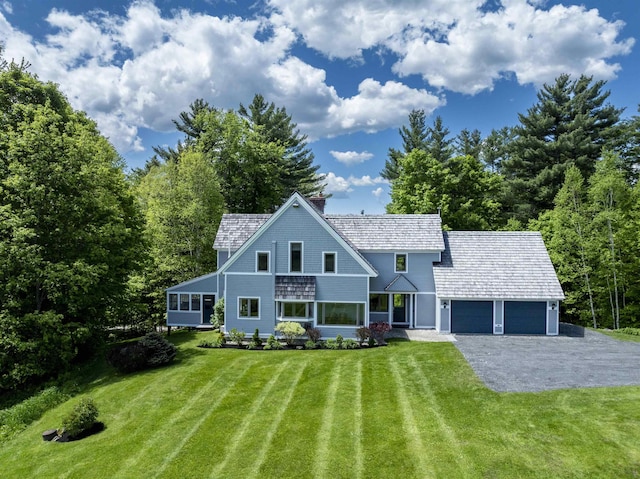 188 Foster Farm Rd, Stowe, VT 05672 - view of front of property with a garage, a front yard, driveway, and a chimney