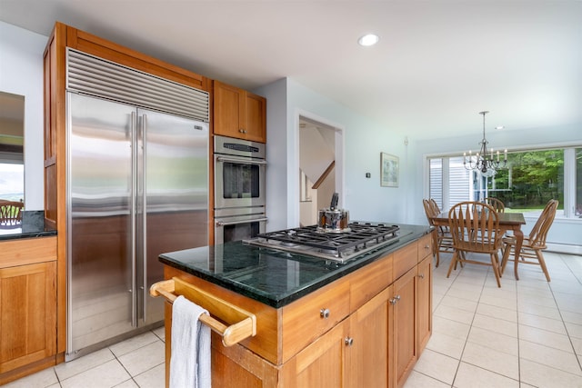 188 Foster Farm Rd, Stowe, VT 05672 - kitchen featuring appliances with stainless steel finishes, light tile patterned flooring, a chandelier, dark stone countertops, and recessed lighting