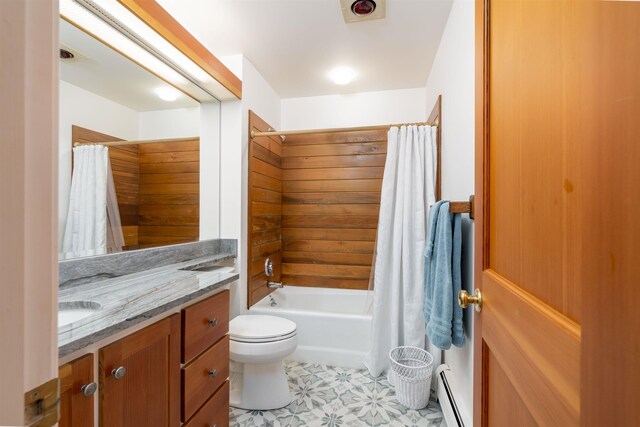 188 Foster Farm Rd, Stowe, VT 05672 - full bathroom featuring a baseboard heating unit, vanity, toilet, and shower / bathtub combination with curtain