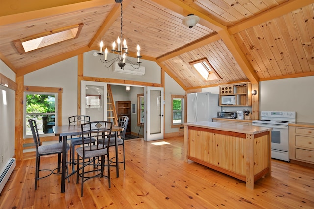 151 Brock Hill Rd, Bridgewater, NH 03222 - kitchen with white appliances, a skylight, a center island, a baseboard radiator, and light wood-style floors