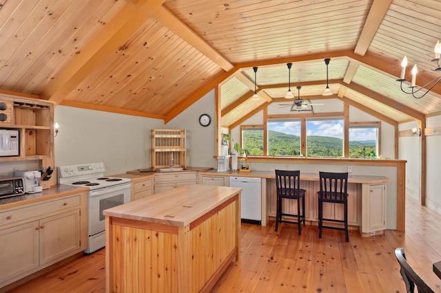 151 Brock Hill Rd, Bridgewater, NH 03222 - kitchen with white appliances, wooden counters, light wood-style flooring, a center island, and ceiling fan