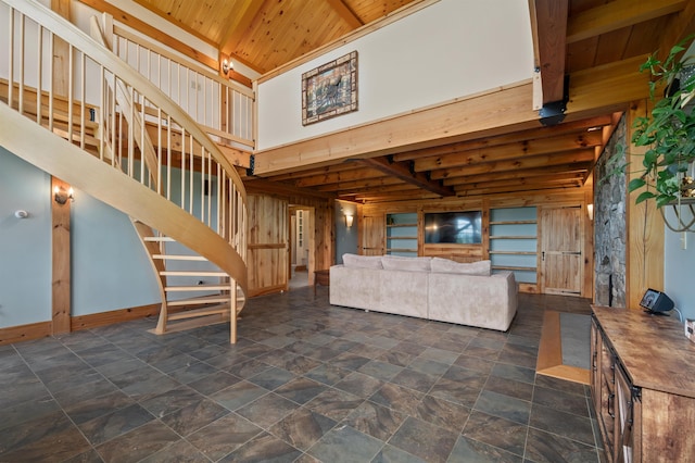 151 Brock Hill Rd, Bridgewater, NH 03222 - unfurnished living room featuring wooden ceiling with exposed beams, stairs, and a high ceiling