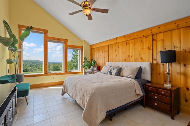 151 Brock Hill Rd, Bridgewater, NH 03222 - bedroom featuring vaulted ceiling, light tile patterned floors, baseboards, wood walls, and a ceiling fan