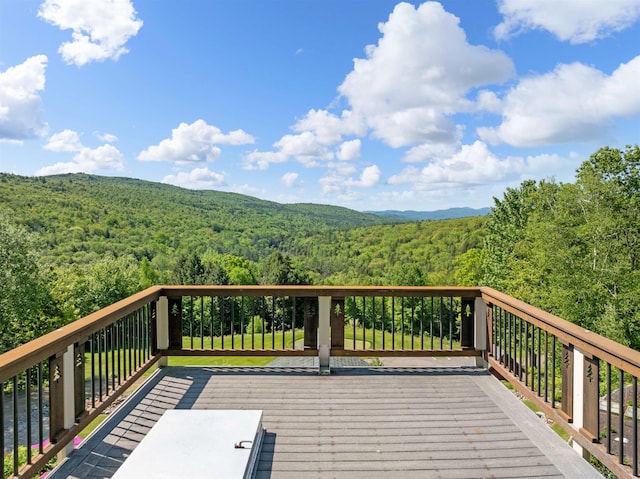 151 Brock Hill Rd, Bridgewater, NH 03222 - wooden deck with a forest view