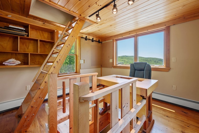 151 Brock Hill Rd, Bridgewater, NH 03222 - stairs with wooden ceiling, track lighting, wood finished floors, and baseboard heating