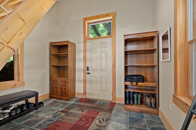 151 Brock Hill Rd, Bridgewater, NH 03222 - foyer featuring baseboards and dark stone finish floors