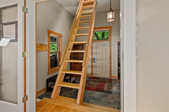 151 Brock Hill Rd, Bridgewater, NH 03222 - staircase with plenty of natural light and baseboards
