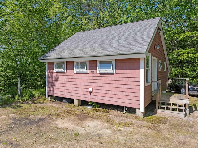 151 Brock Hill Rd, Bridgewater, NH 03222 - view of side of property featuring roof with shingles and a wooden deck
