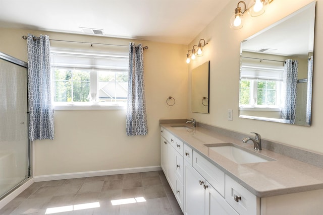 264 Woodview Way, Manchester, NH 03102 - full bathroom with double vanity, baseboards, an enclosed shower, and tile patterned floors