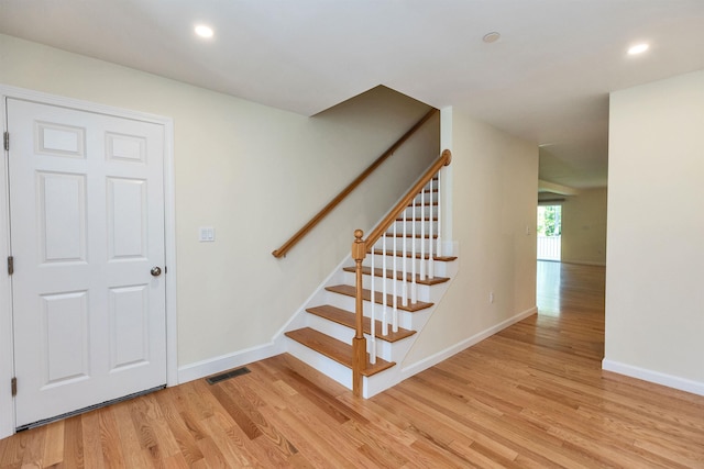 264 Woodview Way, Manchester, NH 03102 - stairs featuring wood finished floors, baseboards, and recessed lighting