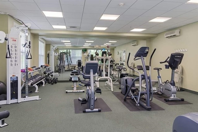 264 Woodview Way, Manchester, NH 03102 - workout area with a wall mounted AC, a wall mounted air conditioner, and a drop ceiling