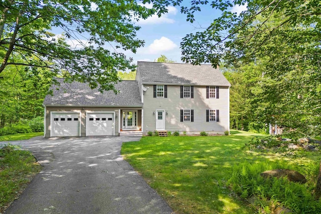 12 Old Fort Ln, Dunbarton, NH 03046 - colonial-style house with driveway, a garage, a front yard, and a shingled roof