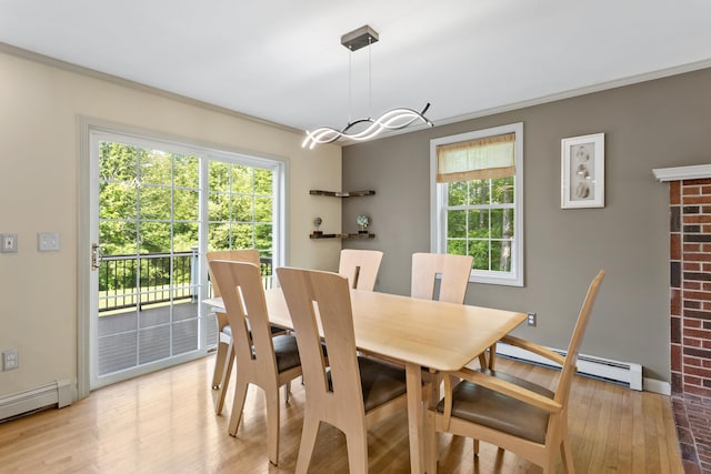 12 Old Fort Ln, Dunbarton, NH 03046 - dining space with a baseboard heating unit, plenty of natural light, light wood-type flooring, and ornamental molding