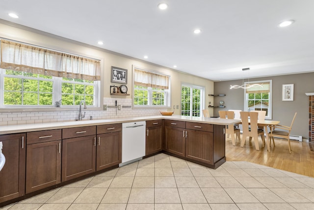 12 Old Fort Ln, Dunbarton, NH 03046 - kitchen with dishwasher, a sink, crown molding, light countertops, and a peninsula