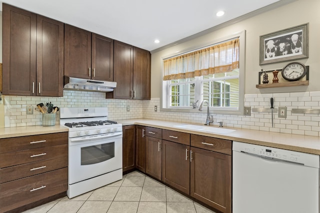 12 Old Fort Ln, Dunbarton, NH 03046 - kitchen featuring white appliances, under cabinet range hood, a sink, light countertops, and decorative backsplash