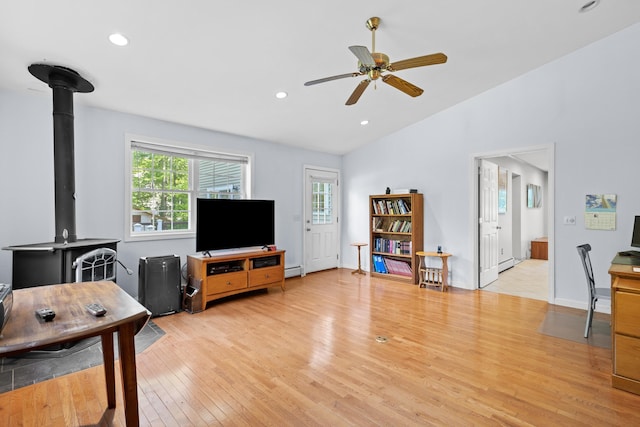 12 Old Fort Ln, Dunbarton, NH 03046 - living room featuring lofted ceiling, a ceiling fan, a wood stove, light wood-style floors, and recessed lighting