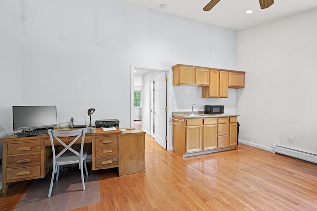 12 Old Fort Ln, Dunbarton, NH 03046 - home office with ceiling fan, light wood-style floors, a sink, a towering ceiling, and baseboards