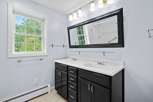 12 Old Fort Ln, Dunbarton, NH 03046 - bathroom featuring baseboard heating, double vanity, healthy amount of natural light, and tile patterned flooring