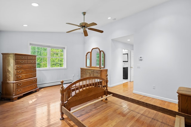 12 Old Fort Ln, Dunbarton, NH 03046 - bedroom featuring a baseboard radiator, light wood-style flooring, recessed lighting, vaulted ceiling, and baseboards