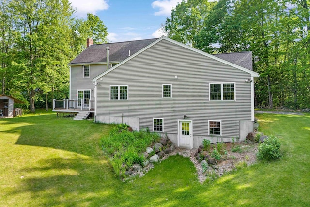 12 Old Fort Ln, Dunbarton, NH 03046 - back of house featuring a lawn, a deck, a chimney, and roof with shingles