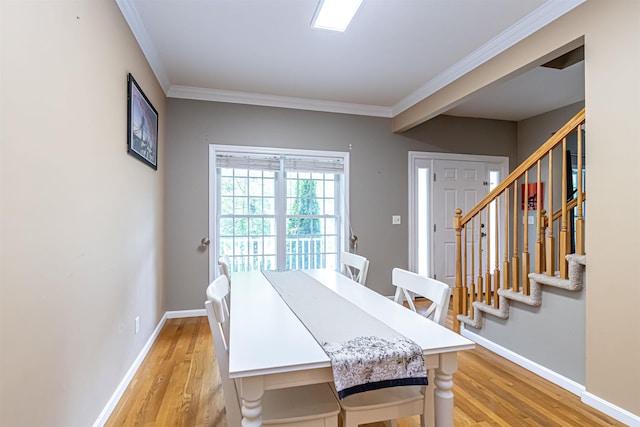 1 Tether Rd, Bedford, NH 03110 - dining room with light wood finished floors, ornamental molding, baseboards, and stairs