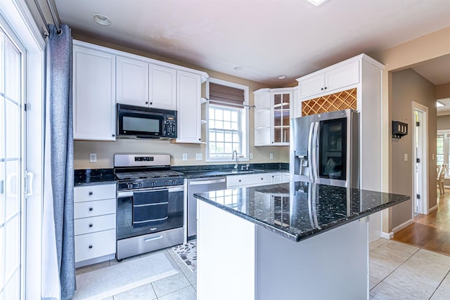 1 Tether Rd, Bedford, NH 03110 - kitchen featuring stainless steel appliances, light tile patterned flooring, white cabinetry, healthy amount of natural light, and recessed lighting