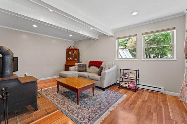 14 Hideaway Ln, Williston, VT 05495 - living area featuring a baseboard heating unit, a wood stove, crown molding, recessed lighting, and baseboards