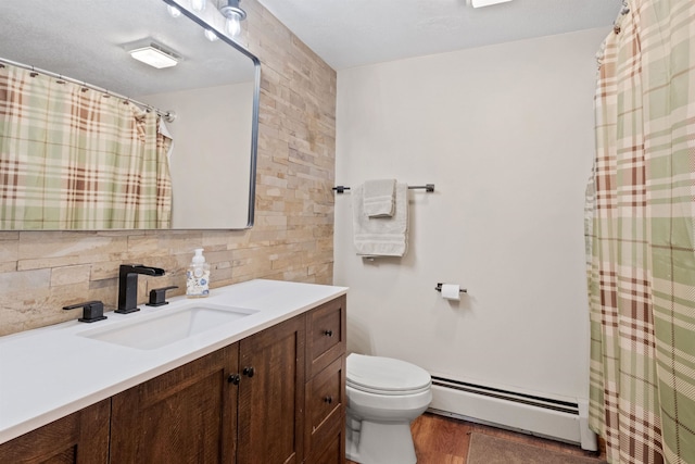 10 Mountain Brook Cir Unit 2, Lincoln, NH 03251 - full bath featuring a baseboard heating unit, toilet, vanity, wood finished floors, and curtained shower