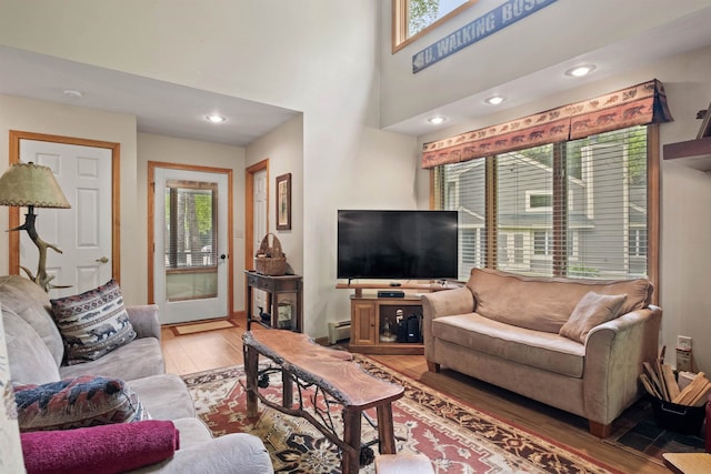 10 Mountain Brook Cir Unit 2, Lincoln, NH 03251 - living room featuring light wood finished floors, a baseboard radiator, recessed lighting, and baseboards