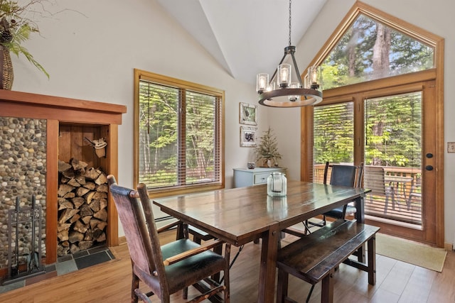 10 Mountain Brook Cir Unit 2, Lincoln, NH 03251 - dining room featuring a chandelier, lofted ceiling, and light wood finished floors