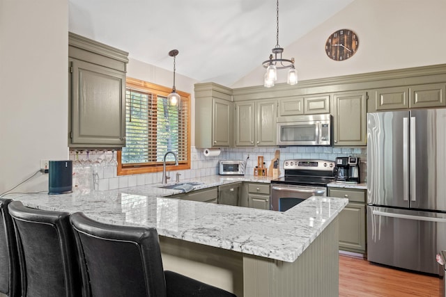 10 Mountain Brook Cir Unit 2, Lincoln, NH 03251 - kitchen featuring stainless steel appliances, a sink, a peninsula, gray cabinets, and pendant lighting