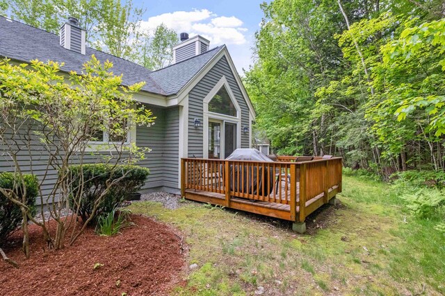 10 Mountain Brook Cir Unit 2, Lincoln, NH 03251 - back of property featuring a deck, a chimney, and roof with shingles