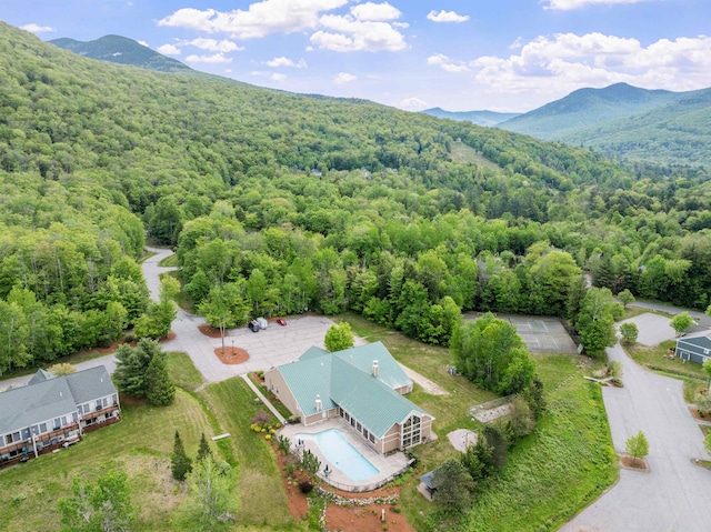 10 Mountain Brook Cir Unit 2, Lincoln, NH 03251 - aerial view of a forest, a mountain backdrop, and a pool