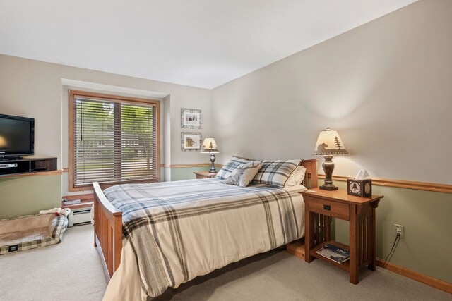 10 Mountain Brook Cir Unit 2, Lincoln, NH 03251 - bedroom featuring light carpet and a baseboard heating unit