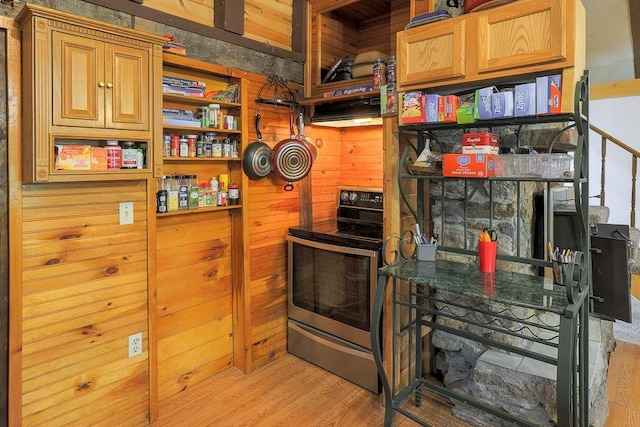 594 Suncook Valley Rd, Alton, NH 03809 - kitchen with stainless steel electric stove, open shelves, light wood-style floors, and wood walls
